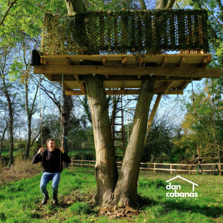 dan swinging from tree house
